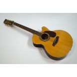 A Brunswick semi-acoustic twelve string guitar (one string missing), model No BTK6012N,