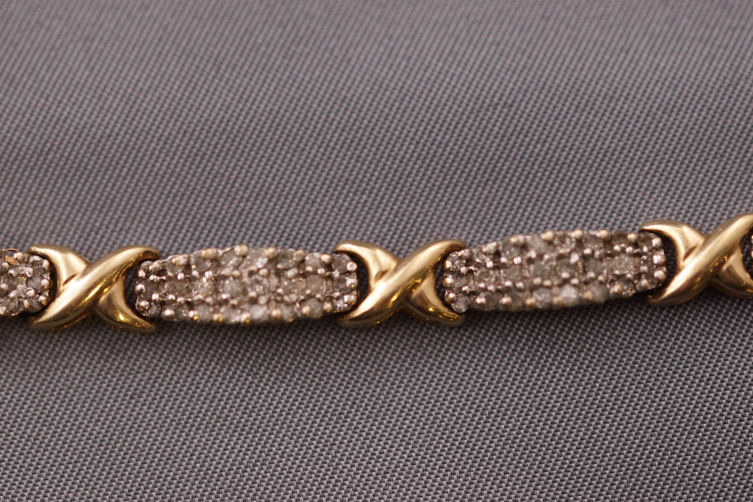 A yellow and white metal diamond bracelet set with round brilliant cut diamonds estimated to be 3. - Image 3 of 3