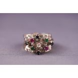 A set of five stacker rings gemset with emeralds, rubies and sapphires. Tests indcate 9ct gold.