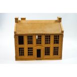 A dolls house in the form of a Georgian residence with four windows above a central door,