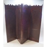 A Victorian mahogany and leather four fold screen with carved crest rail,