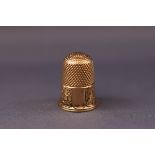 A 9ct gold thimble 6.