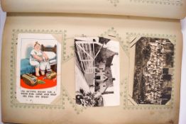 A collection of late 19th and early 20th century postcards within an album,