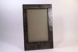 A pewter mounted Royal Welsh photograph frame bearing Prince of Wales feathers crest,