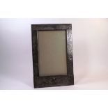 A pewter mounted Royal Welsh photograph frame bearing Prince of Wales feathers crest,