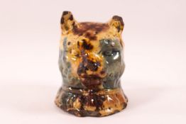 A pottery cat money box with Weilden style glaze in blue, brown and yellow, 10.