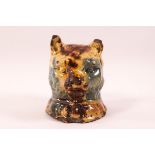 A pottery cat money box with Weilden style glaze in blue, brown and yellow, 10.