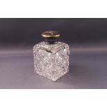 A Victorian square silver mounted square cut glass scent bottle, monogrammed, London 1877,