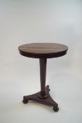 A William IV mahogany occasional table on inverted column and quatre form base,