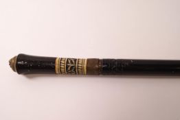 A 19th century Anglo-Indian swordstick with carved bone and ebonised wood handle and brass lion's