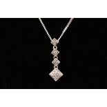 A 9ct white gold cubic zirconia pendant suspended on a filed curb chain together with a pair of 9ct