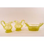 A pair of Victorian uranium cut glass jugs with flared foot, 13cm high,