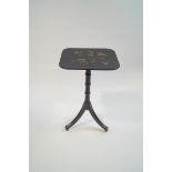 An ebonised Regency style tripod table,