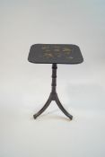 An ebonised Regency style tripod table,