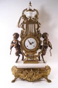 A contemporary Italian marble and gilt metal mantel clock of lyre form, flanked by satyrs,