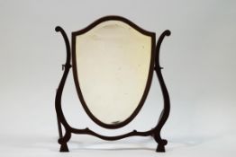 A 19th century mahogany shield shaped swing frame dressing table mirror,
