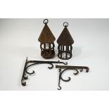 A pair of French iron chateau dungeon lanterns and brackets