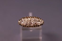 A yellow metal cluster ring set with twelve old cut diamonds 2.30mm to 3.00mm.