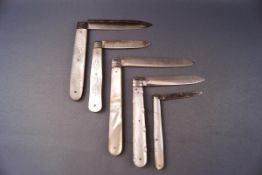Four George III and later silver and mother of pearl handled folding fruit knives including an
