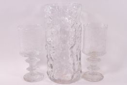 A Swedish moulded glass cylindrical vase, 27cm high, and a pair of Swedish glass goblets,