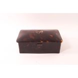 An early 20th century rectangular tortoiseshell box with silver hinges,