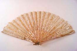 An Edwardian French fan with mother of pearl sticks and lace leaf, in a Duvelleroy box,