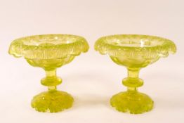 A pair of Victorian uranium cut glass bowls on flared stems and shaped cut glass feet,