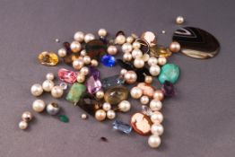 A collection of loose gemstones to include a large oval banded agate, a moss agate, cameo's, quartz,