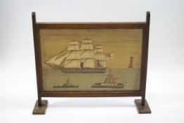 A 19th century ship's woolwork picture of a three masted Man O'War,