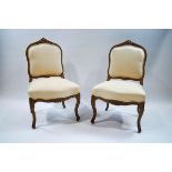A pair of Louis XVI style chairs,