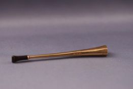 An Art Deco 9ct gold cigarette holder by Alfred Dunhill, of tapering facetted form,