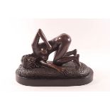 An erotic bronze figure by John Koch on marble base,