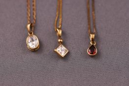 A collection of three 9ct gold pendants and chains. Each stamped 375. Gross weight: 4.