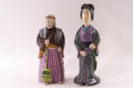 Two Japanese earthenware nodding head figures of women,