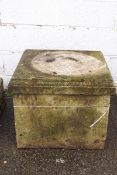 A large re-constituted square plinth,