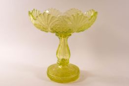 A Victorian uranium glass bowl on baluster stem and flared foot, 23cm high x 22.