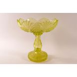 A Victorian uranium glass bowl on baluster stem and flared foot, 23cm high x 22.