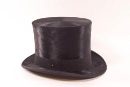 A Dunn & Co moleskin top hat, inside circumference 53cm,