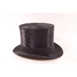 A Dunn & Co moleskin top hat, inside circumference 53cm,