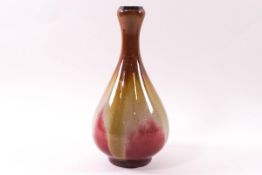 A Chinese porcelain bottle vase with garlic mouth, red, green and brown glazes,