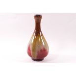 A Chinese porcelain bottle vase with garlic mouth, red, green and brown glazes,