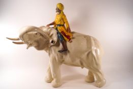 A large painted plaster/chalk ware model of an elephant and his mahout,