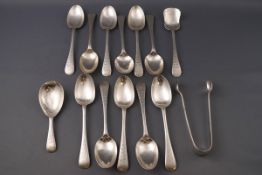 A set of eleven Victorian silver tea spoons, together with matching sugar tongs,