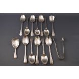 A set of eleven Victorian silver tea spoons, together with matching sugar tongs,