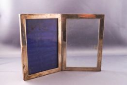 A silver double hinged photograph frame, 16cm x 11cm,