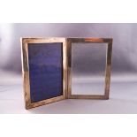 A silver double hinged photograph frame, 16cm x 11cm,