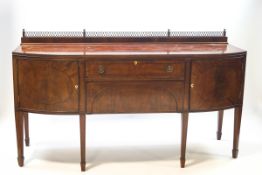 A 19th century mahogany bow front sideboard, crossbanded with ebony stringing,
