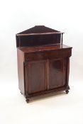 A Victorian mahogany chiffonier with raised shelf back,