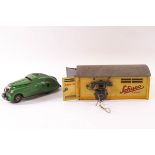 A Schuco tinplate car, Kommando Anno 2000 with garage and telephone, garage 15.