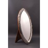 An oval silver frame, with additional mirror glass on easel stand, overall 21cm high x 11cm,